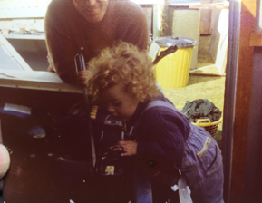 My brother fixing a car with dad