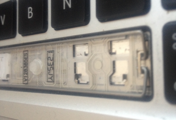 Macbook Pro Space Bar underside showing clibs